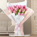 30 pcs pink tulip Grace bouquet by Ward and Haneen with vibrant blooming tulips arranged in a decorative floral display.
