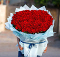300 pcs red rose bouquet by Ward and Haneen, featuring a lush, vibrant array of fresh red roses arranged in a majestic display.