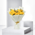 Golden Glow bouquet with yellow and orange flowers, arranged by Ward and Haneen, shown in a vibrant, natural floral display.