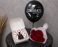 Graduation celebration gift set by Ward and Haneen with themed decorations and accessories for graduates.
