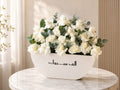 White rose congratulations arrangement by Ward and Haneen featuring elegant white roses in a decorative floral display.