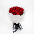 Red Rose Crimson Whisper Wrap by Ward and Haneen with 50 silk flower pieces, ideal for decoration or gifting.