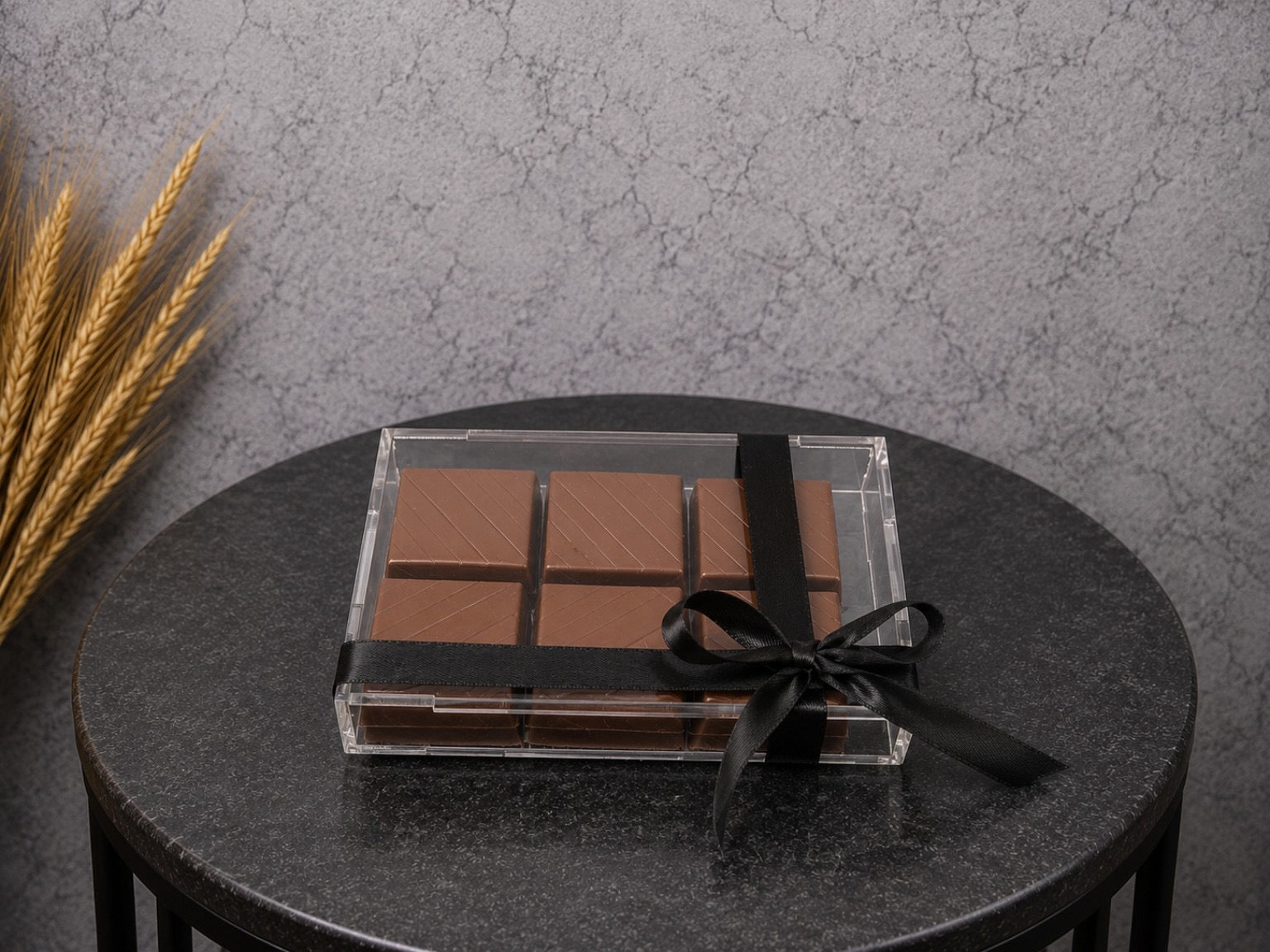 Assorted premium chocolate gift box with 12 pieces from Ward and Haneen, featuring elegant packaging and gourmet chocolates.