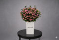 Pink baby rose grand arrangement by Ward and Haneen featuring delicate pink roses in an elegant floral display.