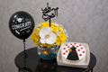 Graduation celebration gift set by Ward and Haneen showing a decorated diploma, congratulatory card, and party accessories.