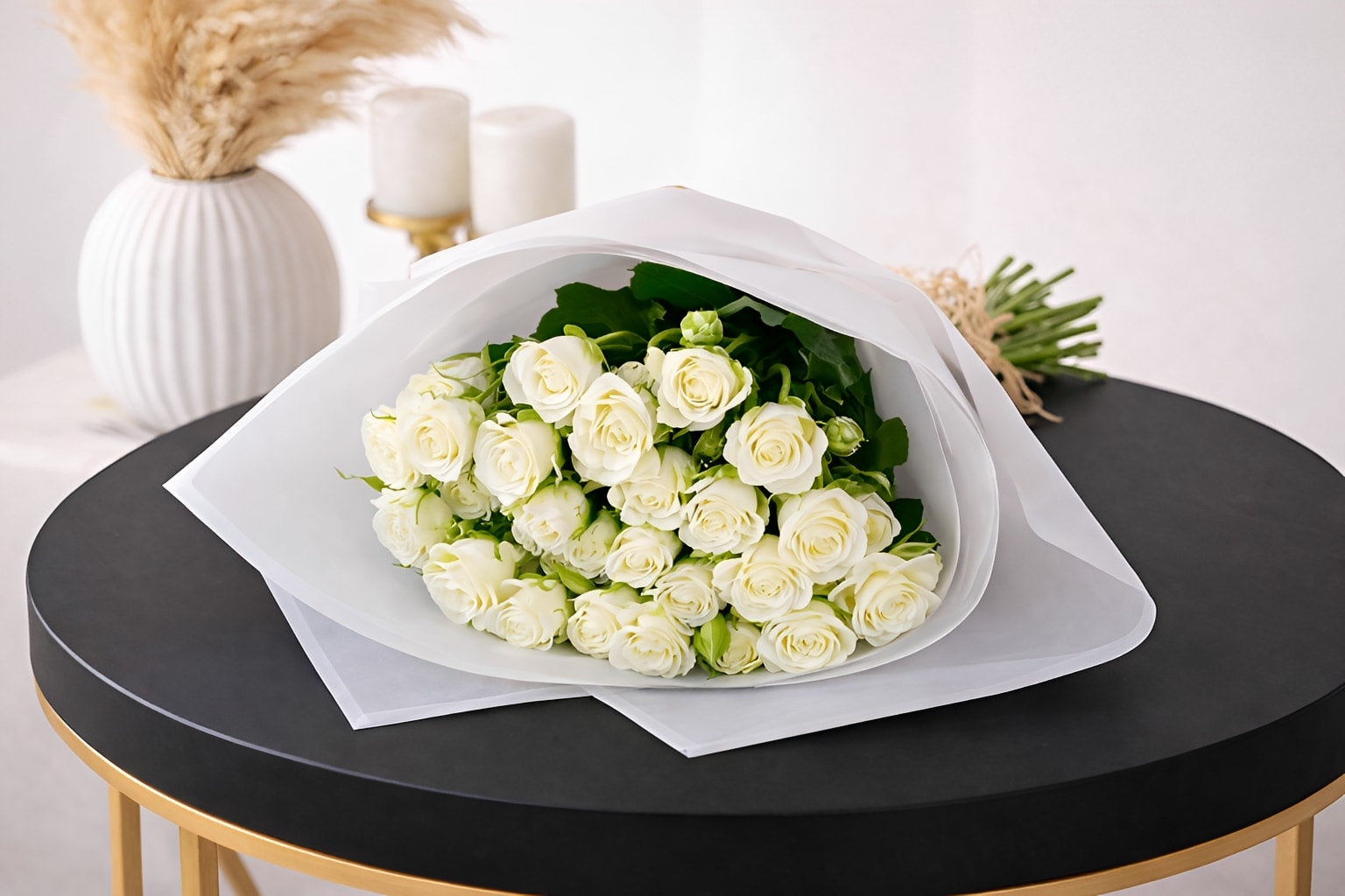 Elegant white rose bouquet by Ward and Haneen, showcasing fresh roses arranged beautifully in a natural floral display.
