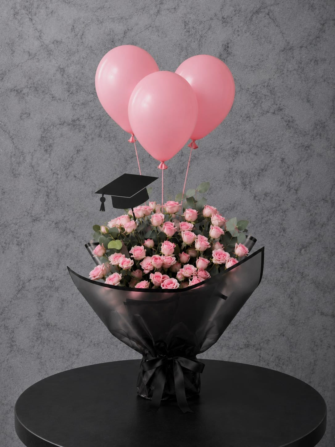 Pink roses graduation bouquet set by Ward and Haneen with vibrant pink roses and greenery, perfect for celebrating graduation.