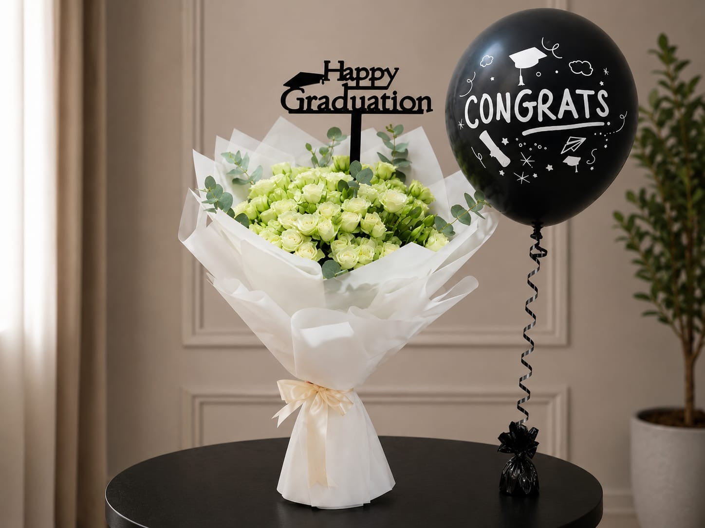 White baby roses and a "Congrats" balloon in the Ward and Haneen graduation gift set, ideal for celebrating academic achievement.