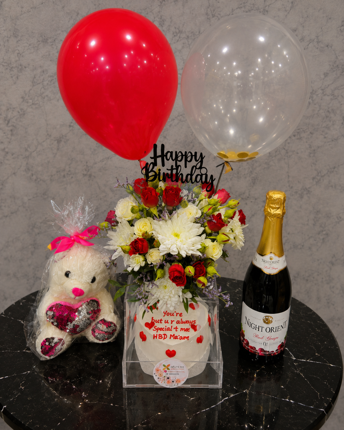 Ward and Haneen birthday celebration gift combo with colorful wrapping, ribbons, and festive decorations for special occasions.
