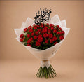 Red baby roses bouquet with graduation-themed accents from Ward and Haneen, perfect for celebration and gifting.