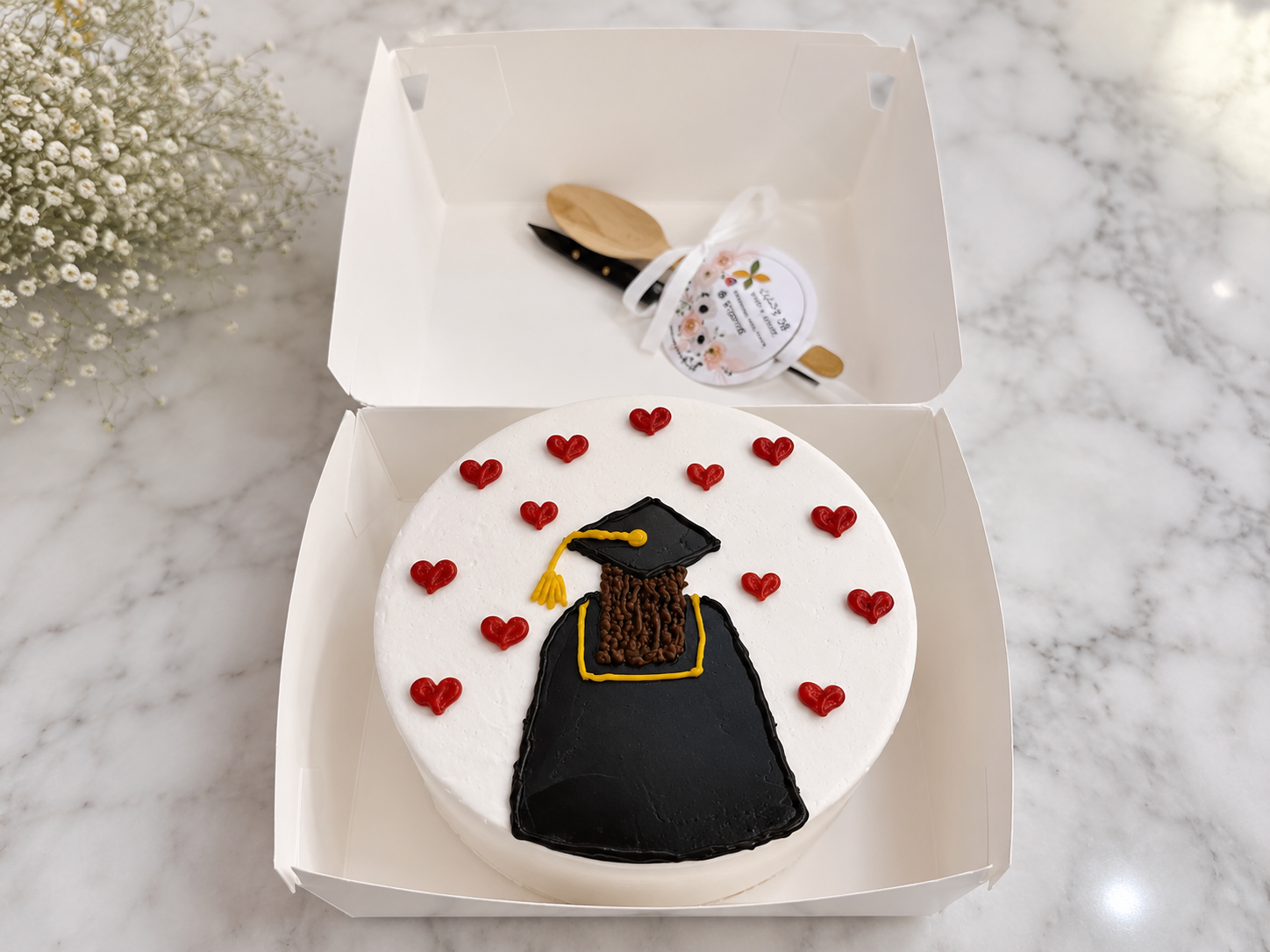 Graduation Bento Cake by Ward and Haneen with colorful decorations and festive design, perfect for celebrating graduation.
