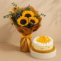 Colorful sunflower bouquet and a decorated celebration cake with floral accents, created by Ward and Haneen.