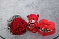 Bouquet of 20 red roses from Ward and Haneen, beautifully arranged with lush green foliage in a classic floral display.