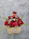 Red roses gift basket with a drink from Ward and Haneen, featuring fresh roses and a beverage in a decorative basket.