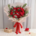 Bouquet of 30 red roses from Ward and Haneen's Supreme Love collection, arranged in a lush floral display.