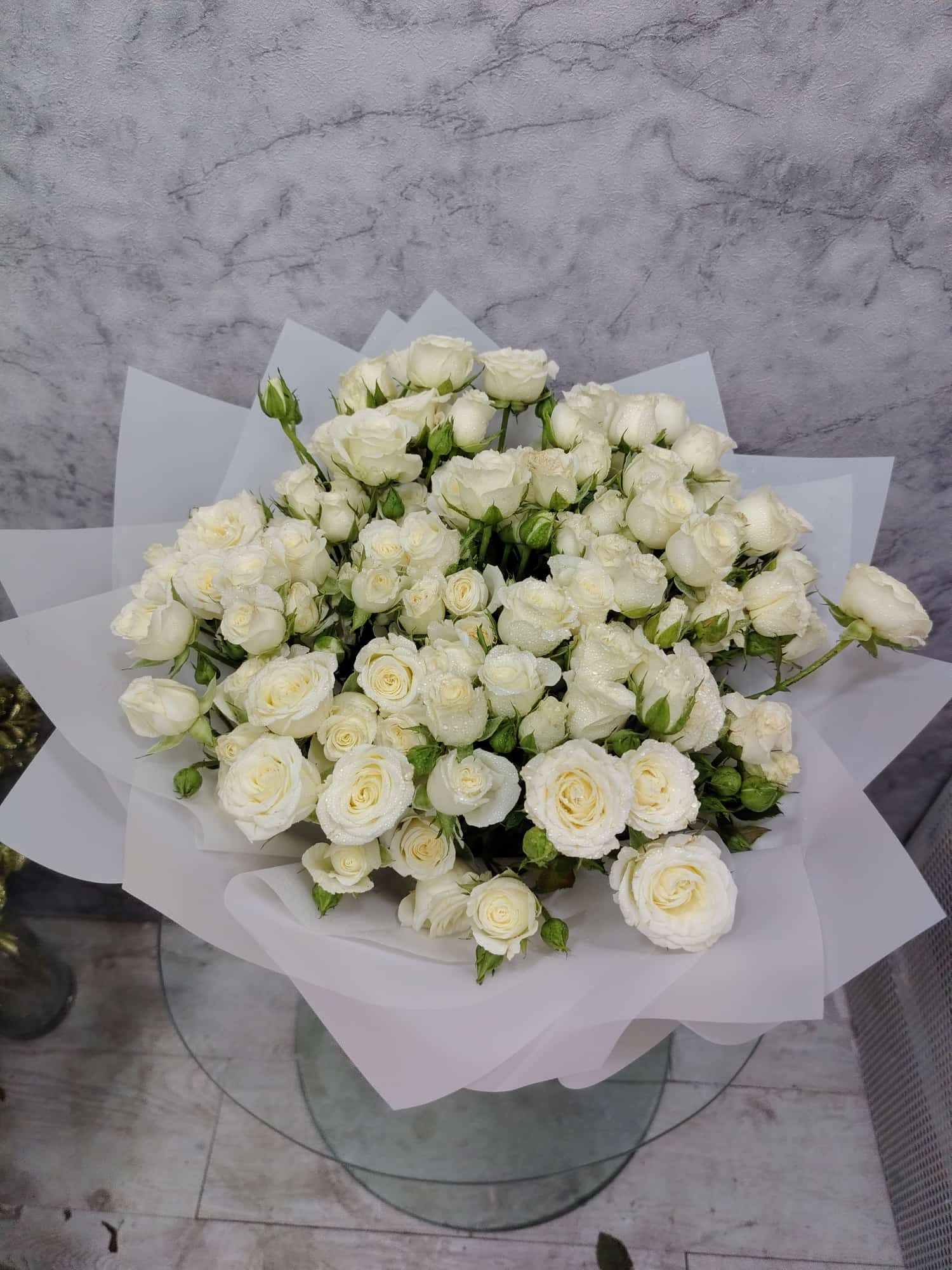 Crimson Deluxe 20 white baby Roses bouquet wrapped with Elegant