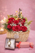 Gift combo basket from Ward and Haneen with fresh flowers, a stylish watch, and chocolates arranged in a decorative basket.