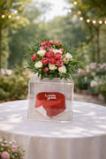 Romantic Bloom & Cake Surprise Box from Ward and Haneen, featuring a floral arrangement and a beautifully decorated cake.