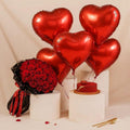 Bright red roses from the Scarlet Love Surprise Set by Ward and Haneen, arranged beautifully in a bouquet.