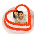 Heart-shaped photo cake by Ward and Haneen featuring a personalized image on a decorated cake for special occasions.