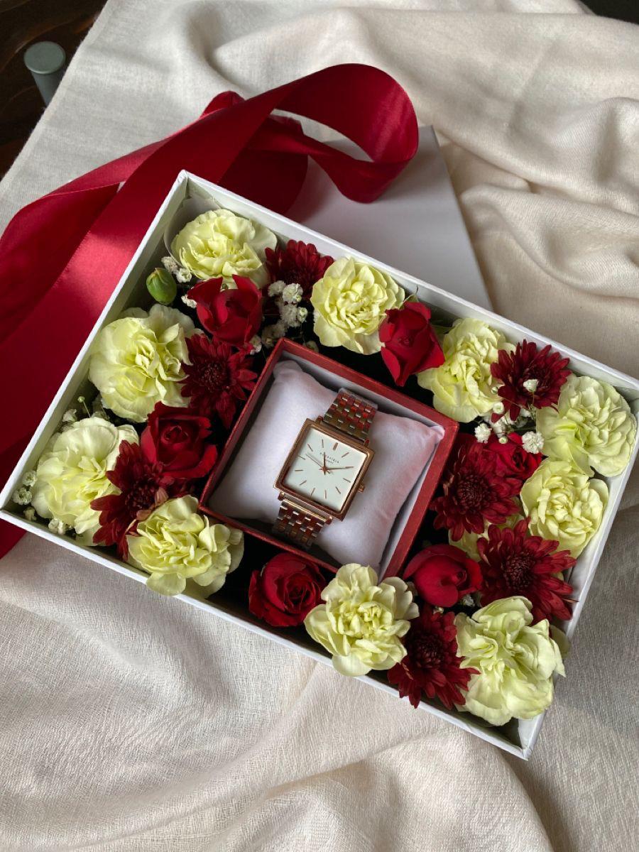 Assorted floral blooms in a gift box by Ward and Haneen, showcasing vibrant flowers arranged in a stylish gift set.