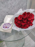 Birthday Bliss Bundle by Ward and Haneen with purple and red themed decorations and party supplies on a festive table.