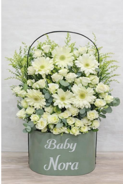 White daisy and rose flower basket by Ward and Haneen, featuring fresh blossoms arranged in a decorative basket.