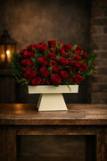 Bouquet of 50 red roses arranged by Ward and Haneen, featuring lush, vibrant red roses in a beautiful floral display.