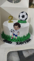 Little Kicker Soccer birthday cake by Ward and Haneen, 7 or 9 inches, decorated with soccer theme and colorful icing.