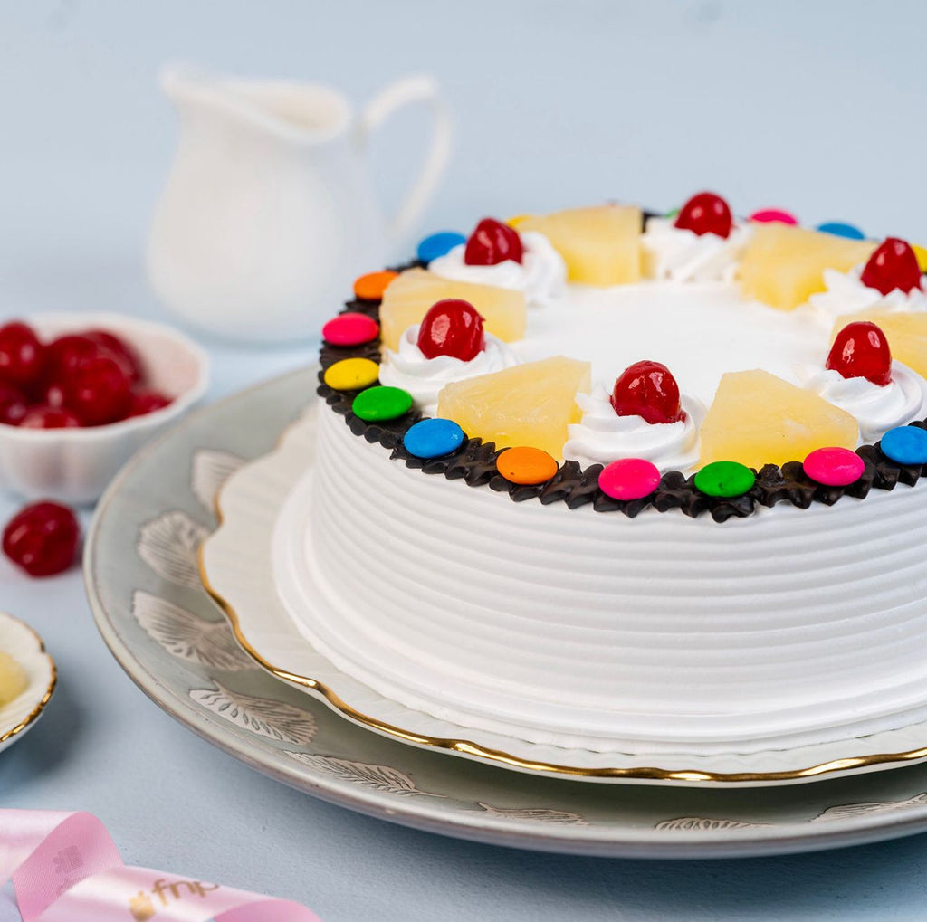 Ward and Haneen Pineapple Gems Cake, 6 or 8-inch, decorated with pineapple-themed icing and colorful toppings.