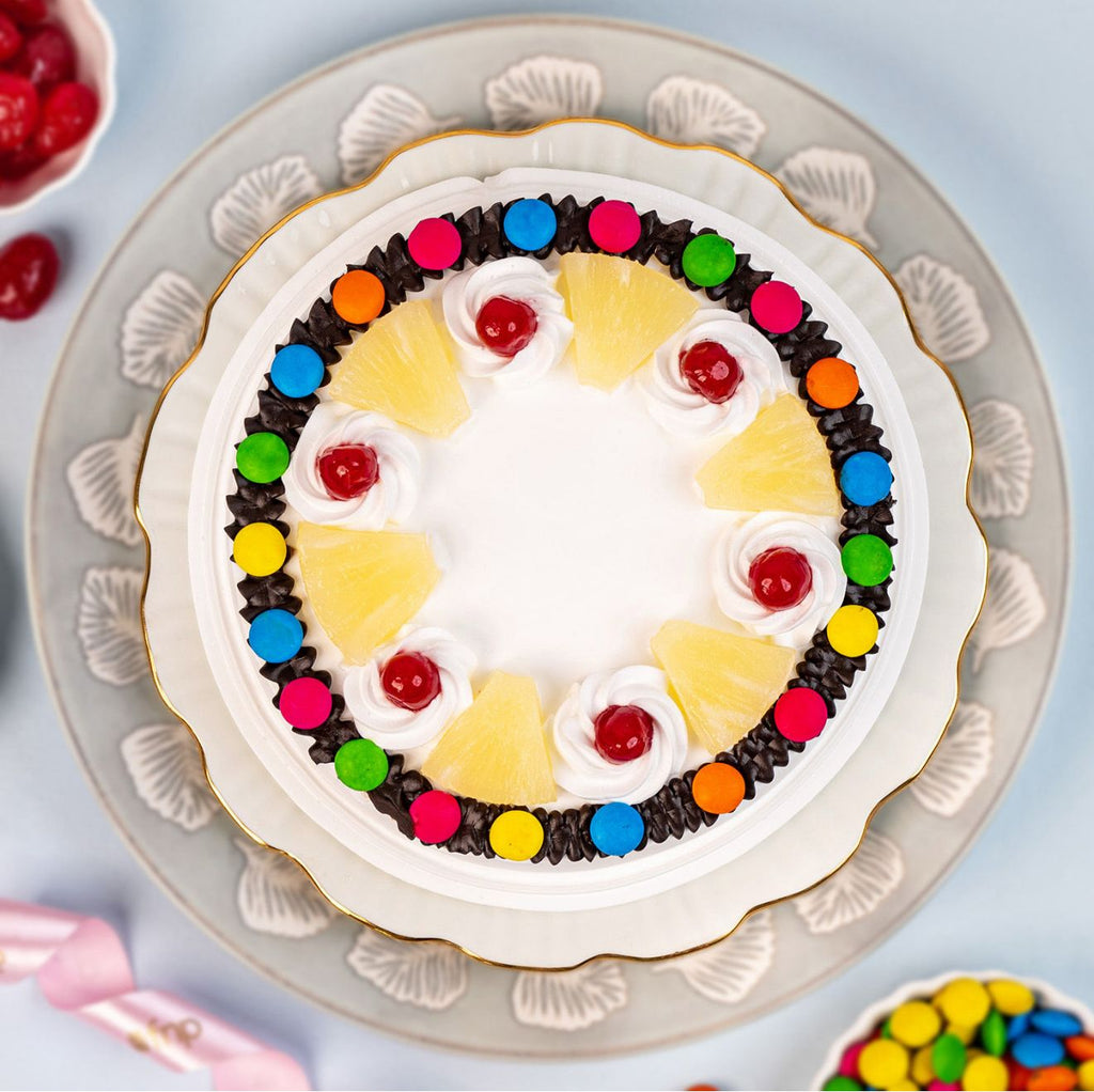 Ward and Haneen Pineapple Gems Cake in 6 or 8 inches, decorated with pineapple-themed cake gems on a festive cake.