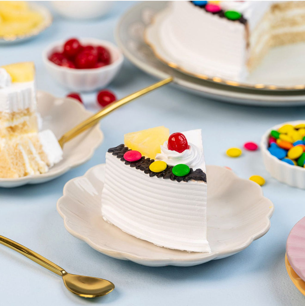 Ward and Haneen Pineapple Gems Cake in 6 or 8 inch size, decorated with pineapple-shaped gems and colorful frosting.