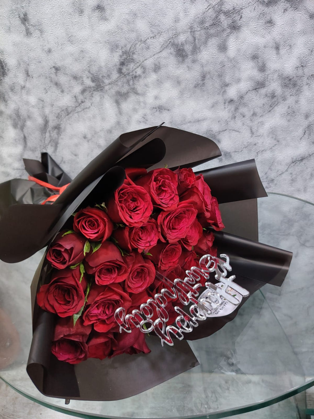Red roses from Ward and Haneen's Midnight Romance Birthday Bouquet arranged in a vibrant floral display.