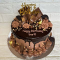 Chocolate Overload Birthday Cake by Ward and Haneen, 7 or 9 inches, decorated with rich chocolate frosting and toppings.