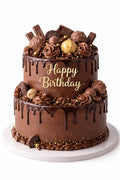 Gilded Truffle Two-Tier Birthday Cake by Ward and Haneen with gold accents and elegant design, displayed on a cake stand.