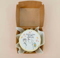 White mini bento cake for Ramadan celebration by Ward and Haneen, decorated with festive designs.