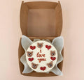 Mini bento cake with teddy bear and heart decorations, featuring "I Love You" message from Ward and Haneen.