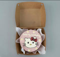 Pink Hello Kitty birthday mini bento cake by Ward and Haneen, decorated with Hello Kitty figure and festive pink icing.