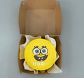 Yellow SpongeBob birthday mini bento cake by Ward and Haneen, featuring a colorful SpongeBob design on top.