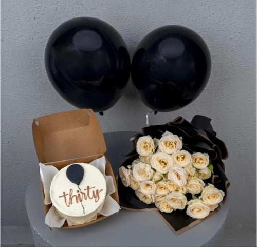 Ward and Haneen Thirty & Thriving Midnight Celebration Bundle with birthday decorations and party accessories in the image.