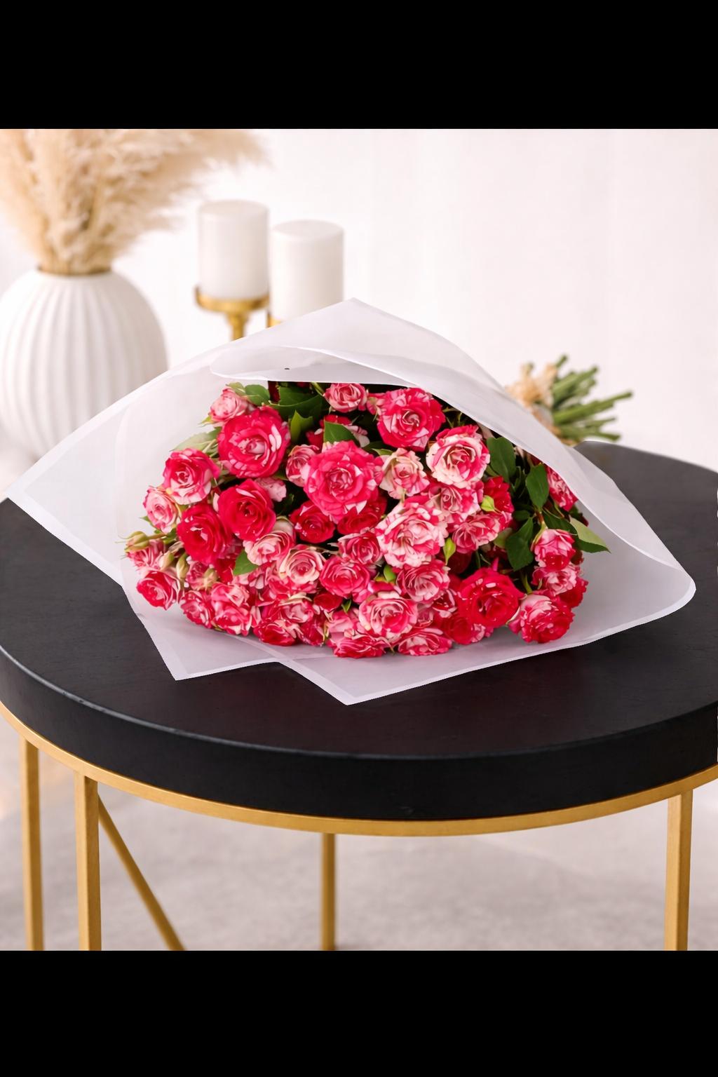 Soft blooms and bold love floral arrangement by Ward and Haneen, featuring vibrant flowers in a stylish display.